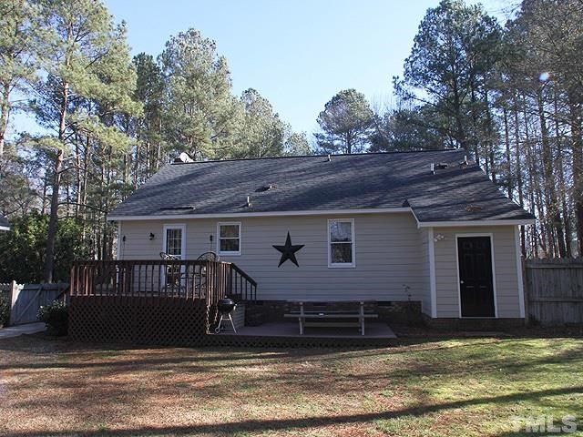 5767 Cornwallis Road Garner, NC 27529 - Photo 14 of 17 Exterior view showing upper deck and lower patio. Great for entertaining or winding down after a long day. Also addition storage room on the right side of the home.