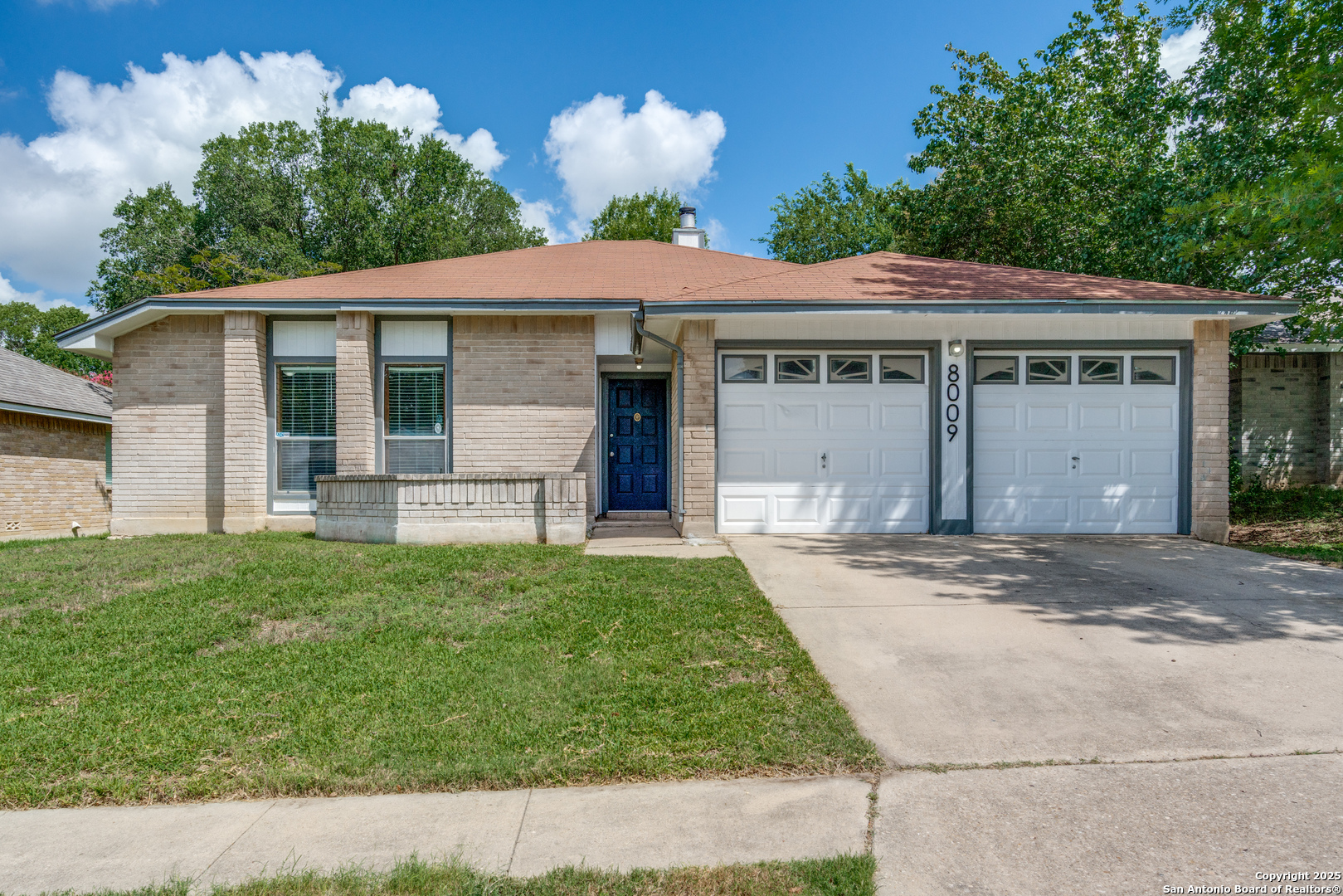 8009 Forest Ash Live Oak, TX 78233 - Photo 1 of 33 a front view of a house with a garden