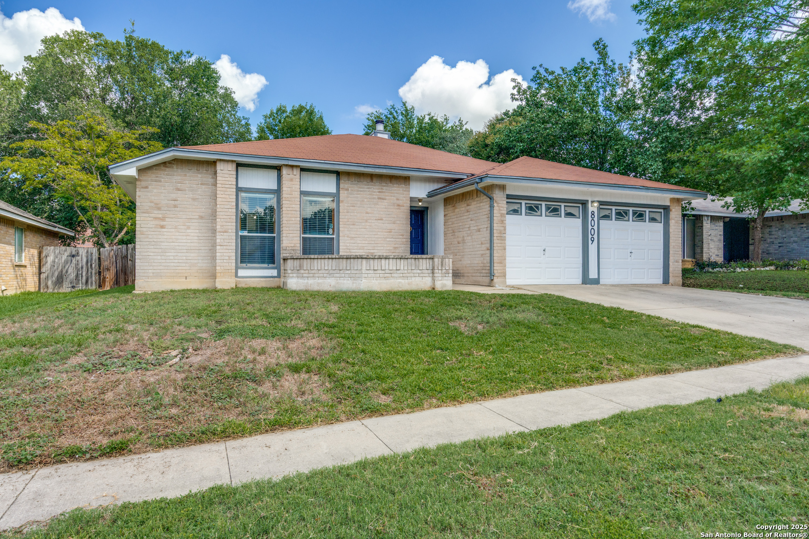 8009 Forest Ash Live Oak, TX 78233 - Photo 2 of 33 a view of a house with a yard and large tree