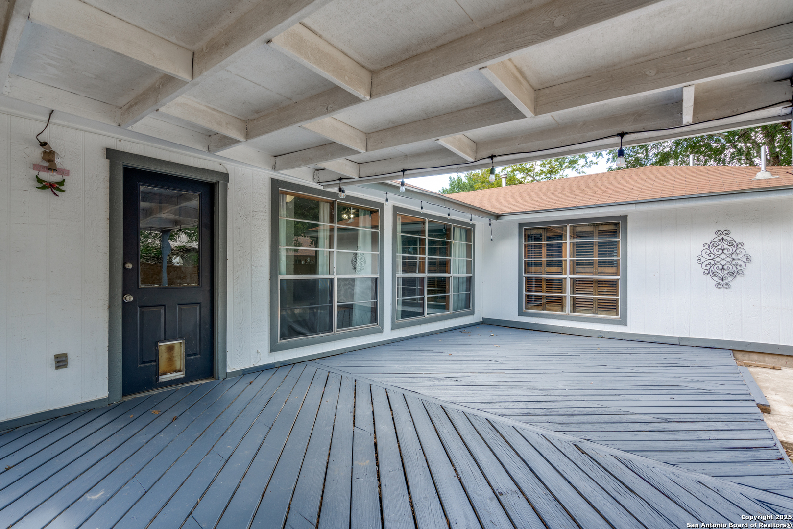 8009 Forest Ash Live Oak, TX 78233 - Photo 32 of 33 an empty room with wooden floor and windows