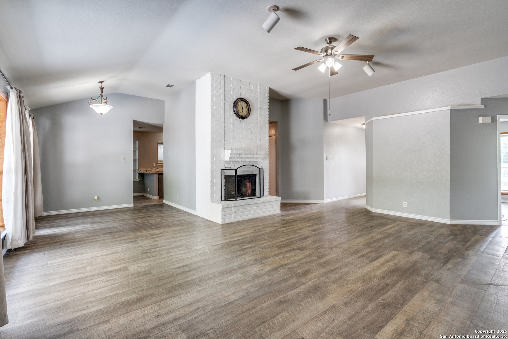 8009 Forest Ash Live Oak, TX 78233 - Photo 5 of 33 a view of an empty room with a fireplace