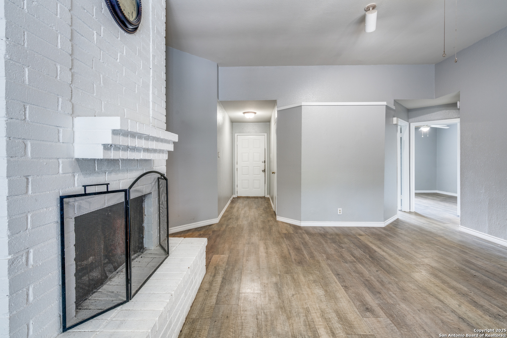 8009 Forest Ash Live Oak, TX 78233 - Photo 10 of 33 a view of empty room with wooden floor and fan