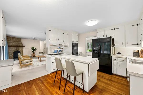 an empty room with a ceiling fan and a window