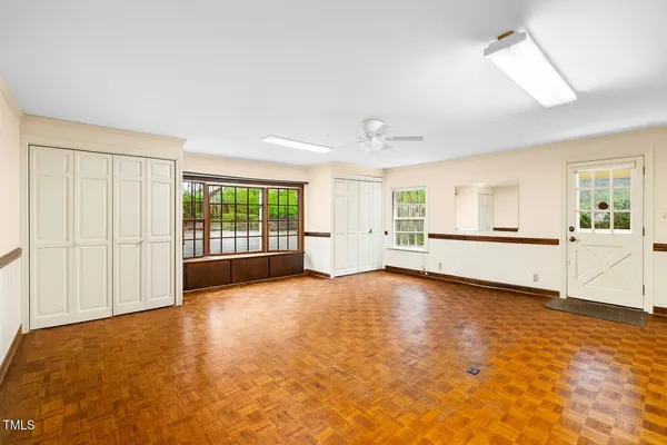 a view of a house with backyard and a garden