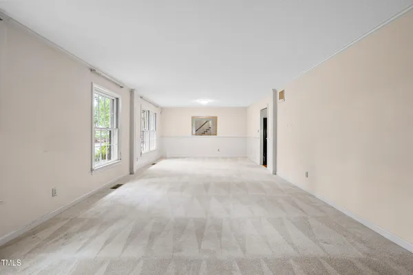 a view of empty room with a fireplace
