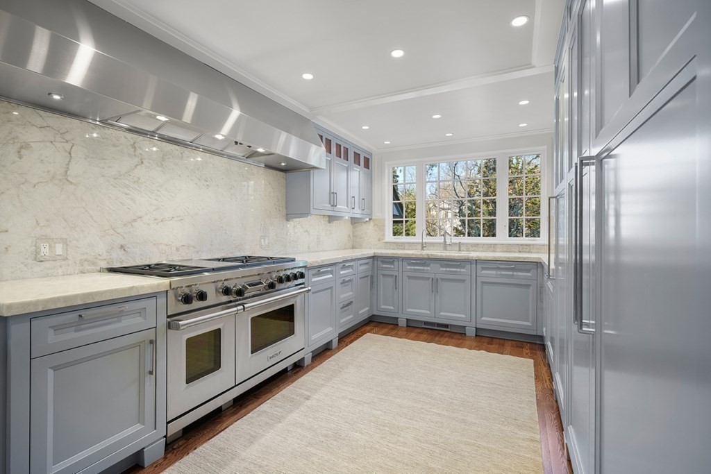 89 Ledgeways Wellesley, MA 02481 - Photo 11 of 42 a kitchen with a stove a sink and a refrigerator