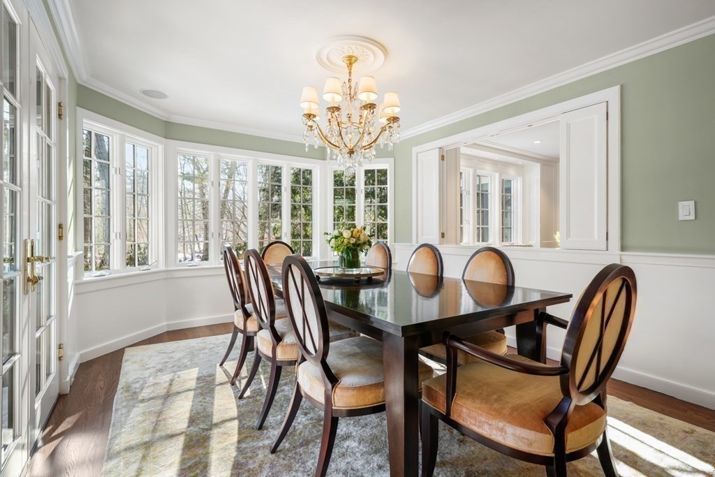 89 Ledgeways Wellesley, MA 02481 - Photo 19 of 42 a view of a dining room with furniture a chandelier and wooden floor