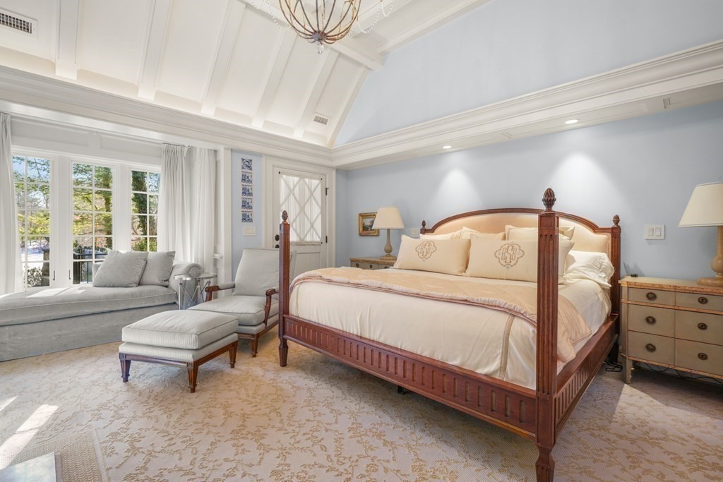 89 Ledgeways Wellesley, MA 02481 - Photo 25 of 42 a bedroom with a bed couch and windows