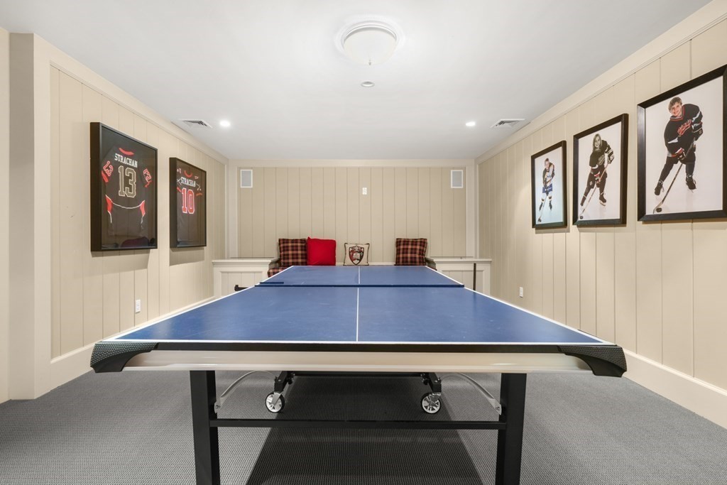 89 Ledgeways Wellesley, MA 02481 - Photo 36 of 42 a room with furniture and paintings on the wall