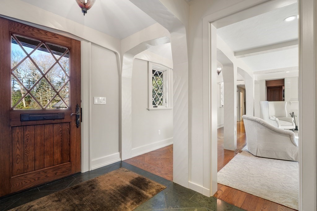 89 Ledgeways Wellesley, MA 02481 - Photo 6 of 42 a view of a hallway view with wooden floor and cabinet