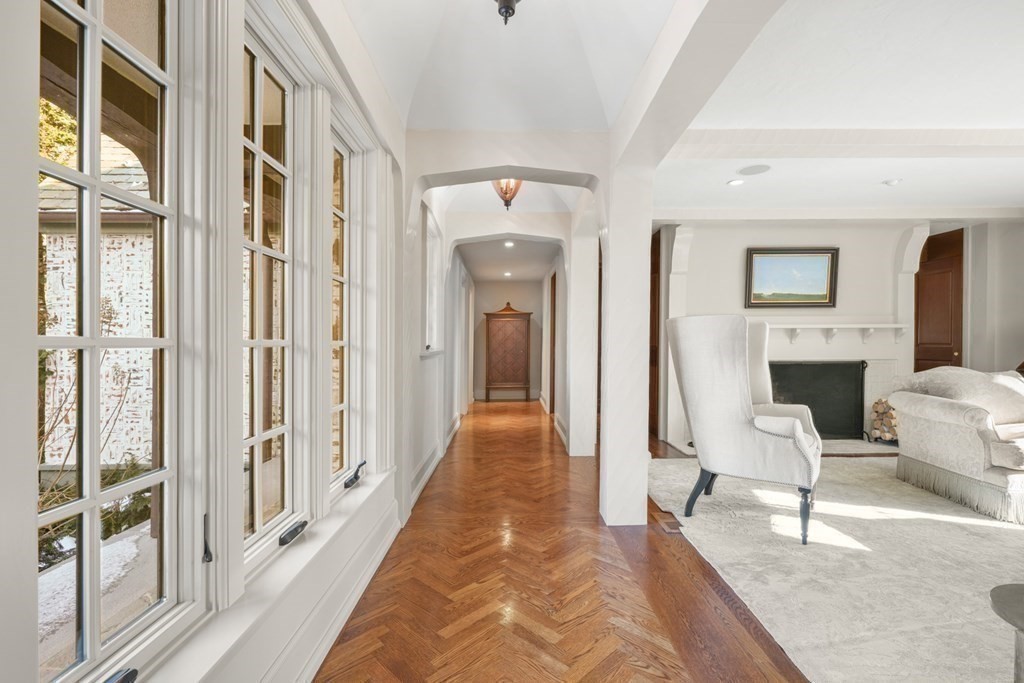 89 Ledgeways Wellesley, MA 02481 - Photo 7 of 42 a view of a hallway with furniture and a fireplace