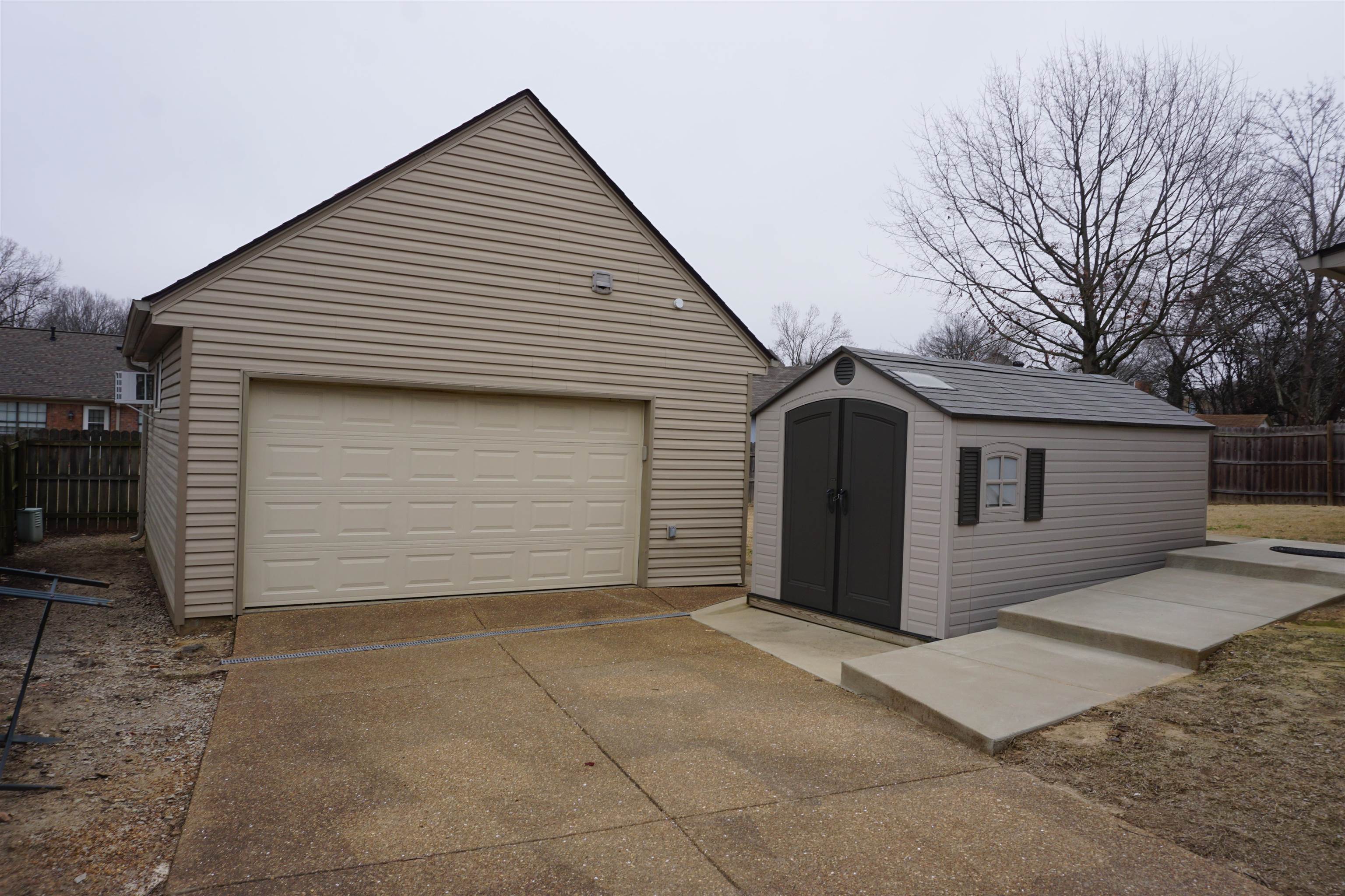 6320 Yale Road Bartlett, TN 38134 - Photo 2 of 25 a front view of a house with garage