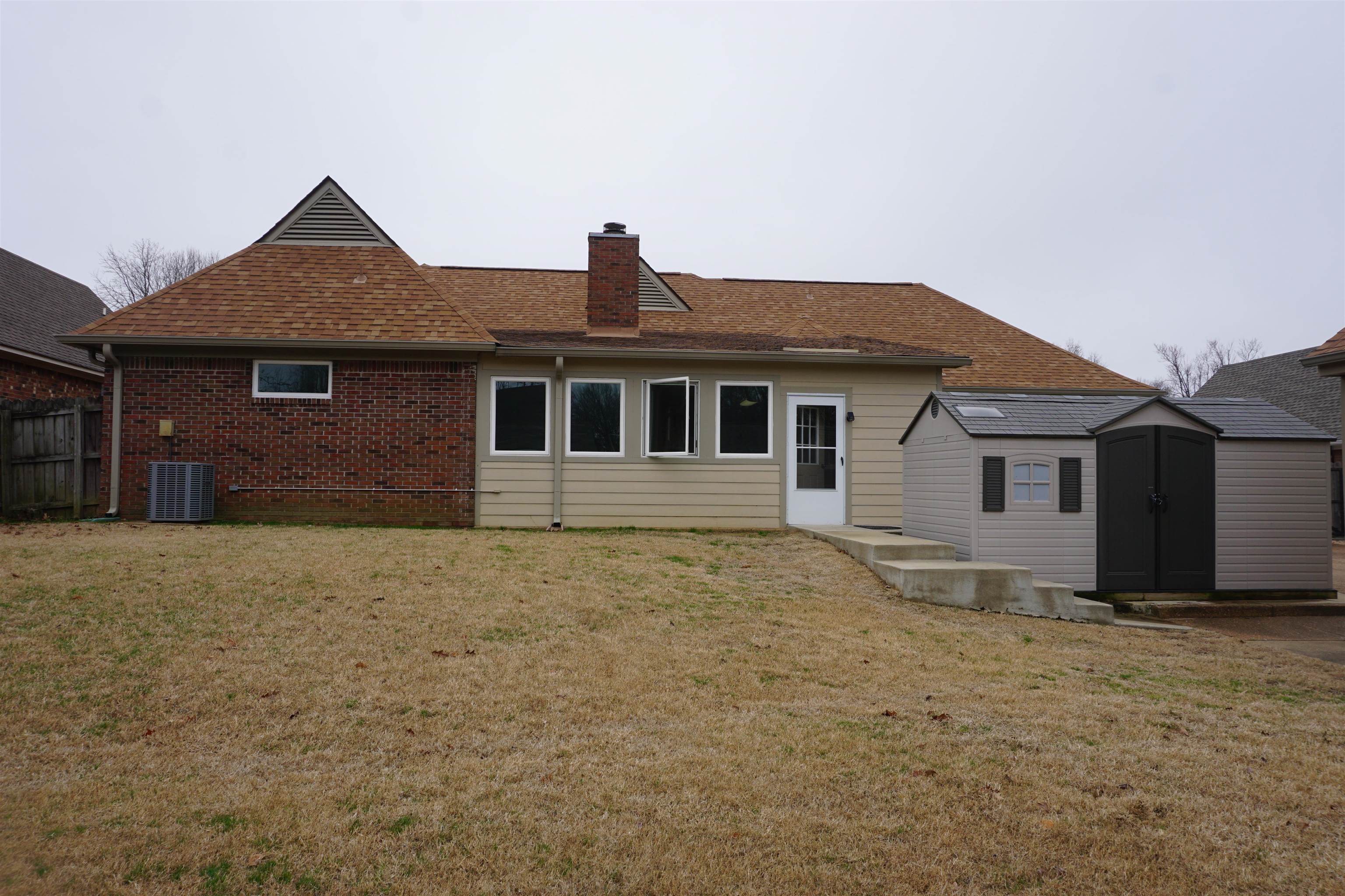 6320 Yale Road Bartlett, TN 38134 - Photo 23 of 25 a front view of a house with a yard