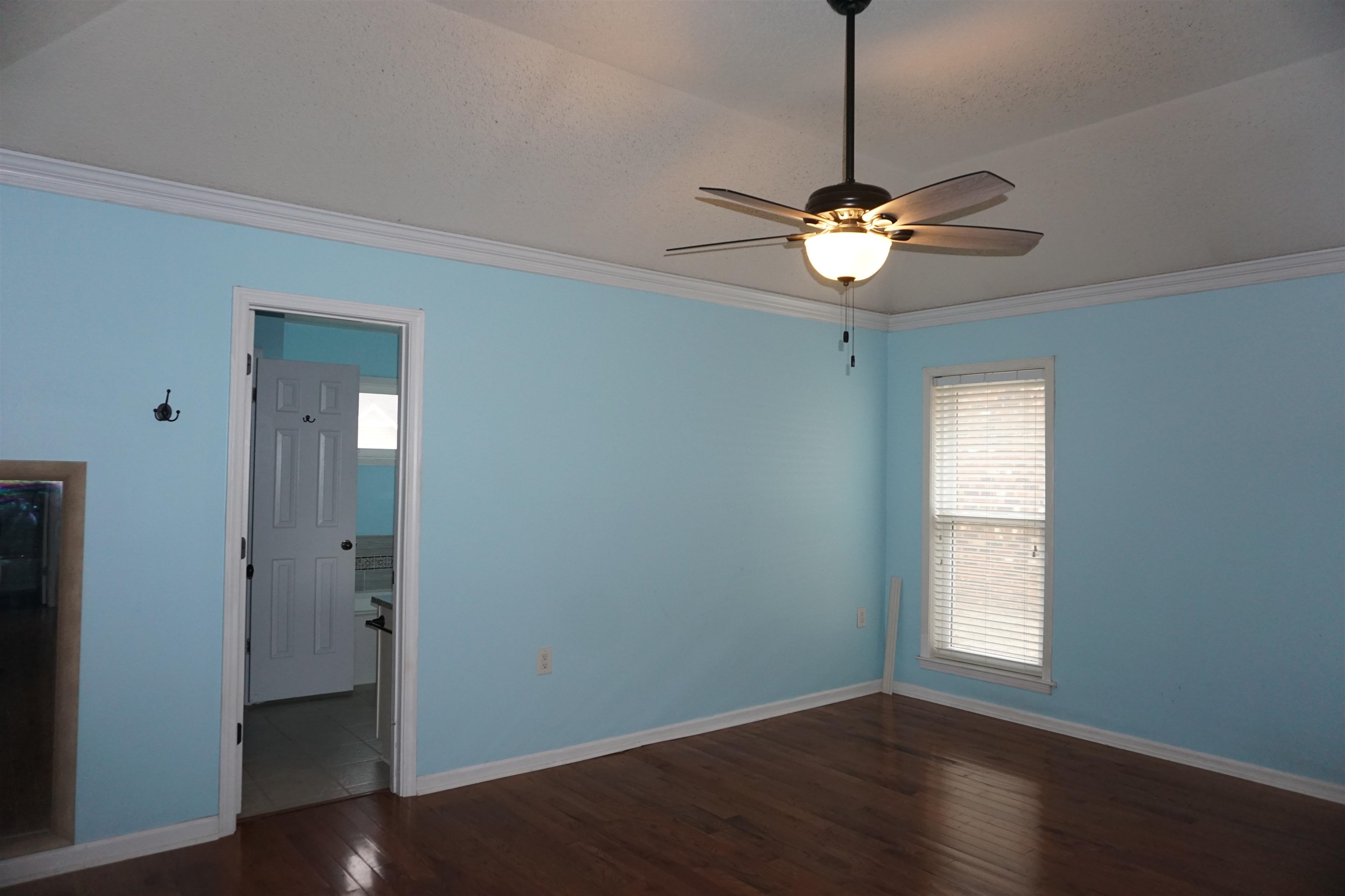 6320 Yale Road Bartlett, TN 38134 - Photo 5 of 25 a view of a chandelier fan and wooden floor