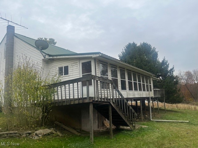 3035 Slack Road Mount Perry, OH 43760 - Photo 3 of 24 Back of property featuring a wooden deck, stairway, a chimney, a lawn, and a metal roof
