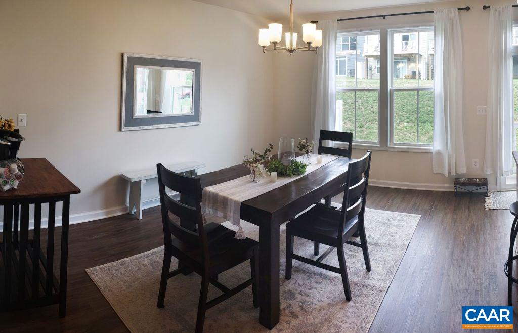 2180 Avinity Loop Charlottesville, VA 22902 - Photo 11 of 32 a view of a dining room with furniture window and wooden floor