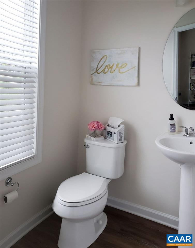 2180 Avinity Loop Charlottesville, VA 22902 - Photo 12 of 32 a bathroom with a toilet a sink and a mirror
