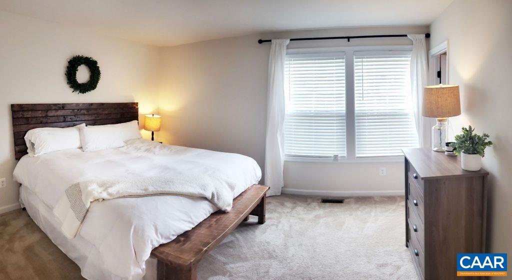2180 Avinity Loop Charlottesville, VA 22902 - Photo 15 of 32 a bedroom with a bed and a window