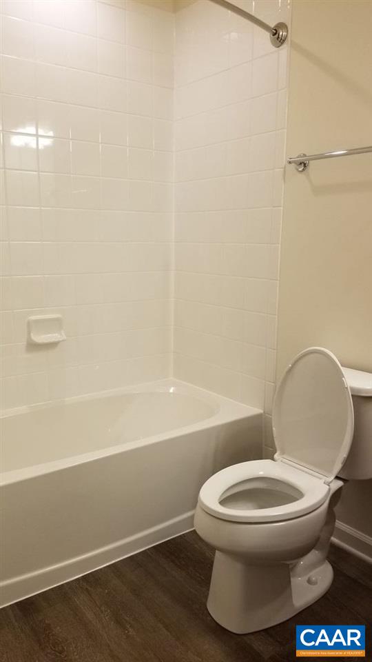 2180 Avinity Loop Charlottesville, VA 22902 - Photo 24 of 32 a white toilet sitting next to a bath tub and a shower