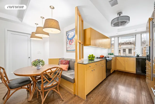 a dining room with furniture a rug and a chandelier