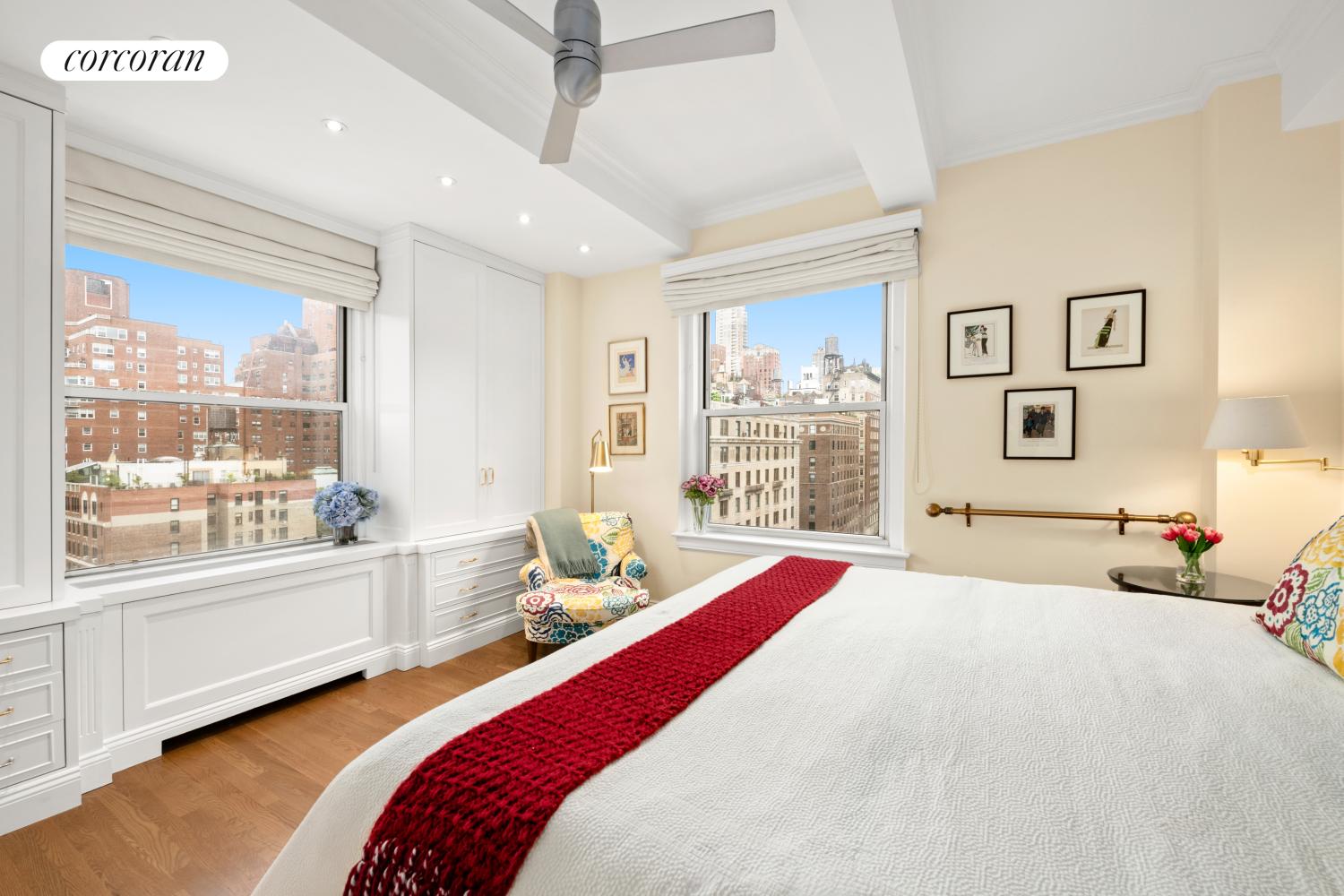 135 East 74th Street, Unit 11BC Manhattan, NY 10021 - Photo 8 of 13 a bedroom with a bed and a large window with the outer view