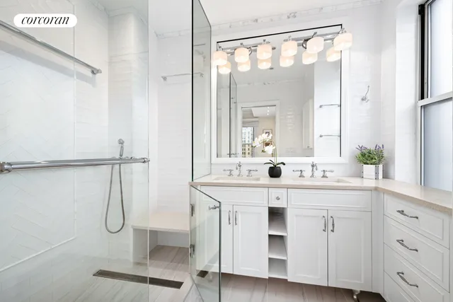 a bedroom with a bed and a large window with the outer view