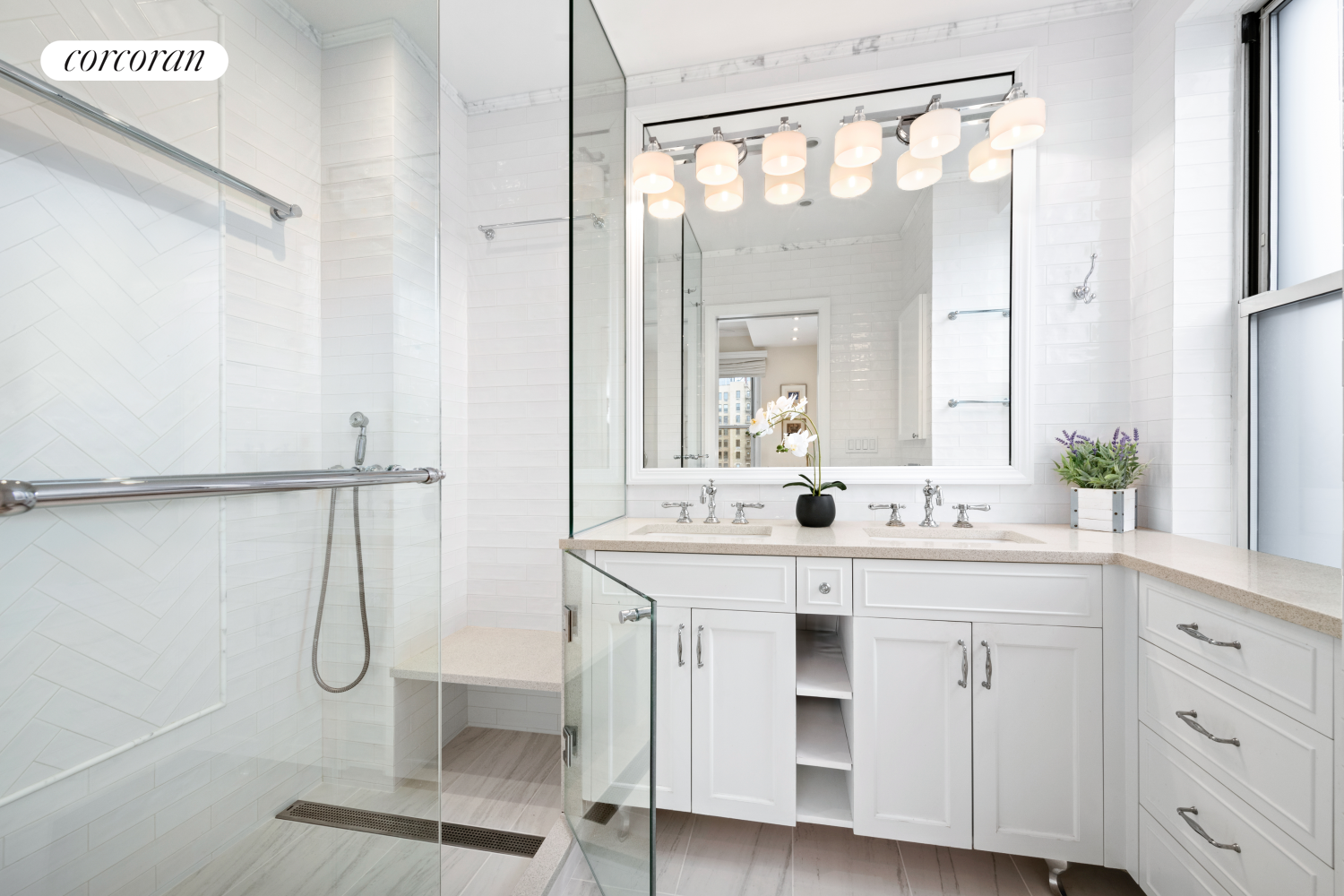 135 East 74th Street, Unit 11BC Manhattan, NY 10021 - Photo 9 of 13 a bathroom with a double vanity sink mirror and shower