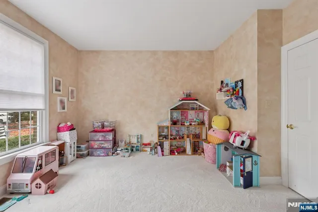 a bed room with a bed and a chair