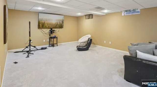 a bathroom with a toilet and a shower curtain