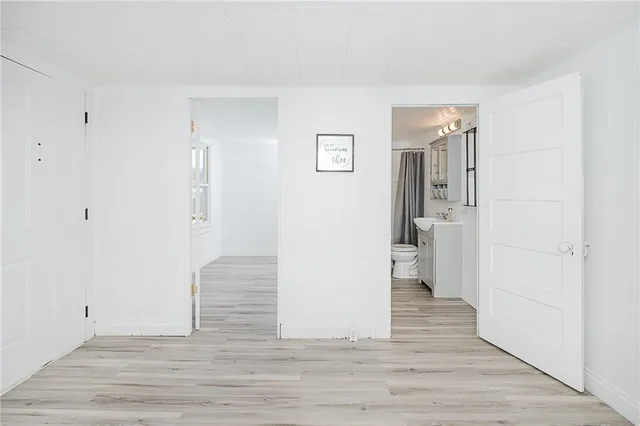 a view of wooden floor and windows in a room