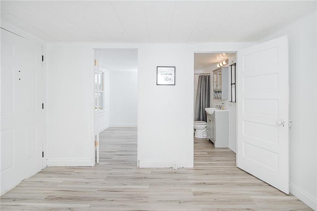 336 Walkchalk Road Kittanning, PA 16201 - Photo 13 of 49 a view of wooden floor and windows in a room