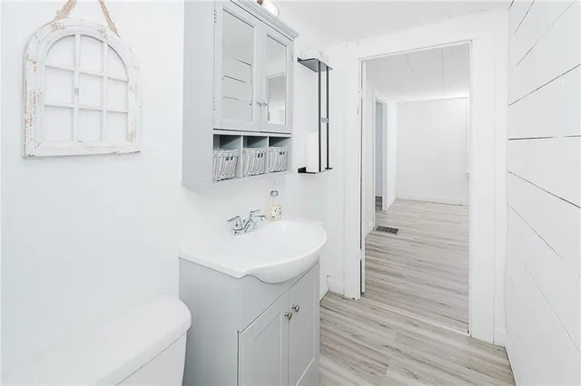 a bathroom with a sink a mirror and a shower