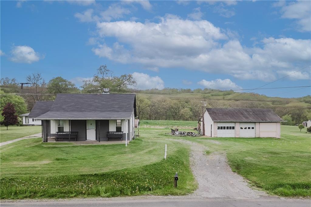 336 Walkchalk Road Kittanning, PA 16201 - Photo 2 of 49 a view of a house with a big yard and large tree
