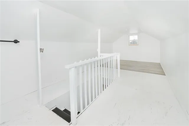 a view of a hallway with white walls