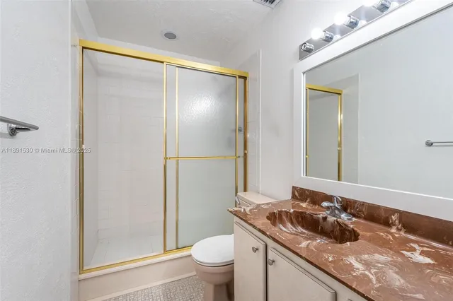 a view of house with backyard and trees