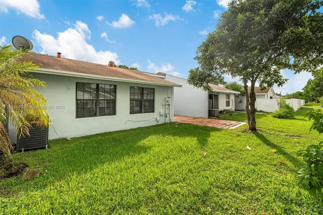 a view of backyard with green space
