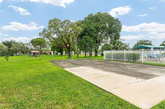 a view of house with swimming pool outdoor seating area and barbeque oven
