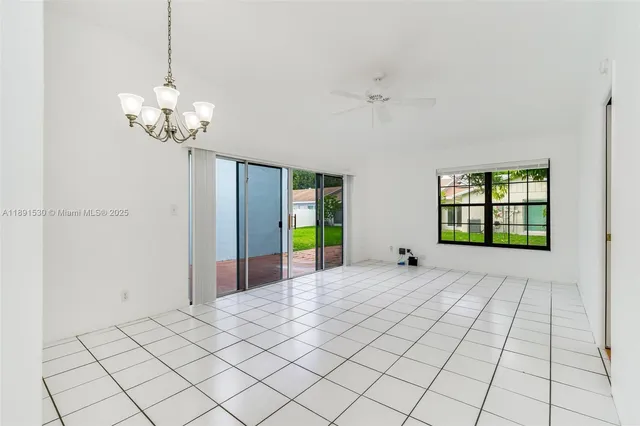 a view of a kitchen with electric appliances