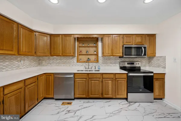 a view of an empty room with glass door