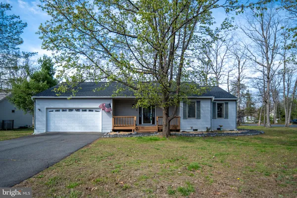 a front view of house with yard and seating area
