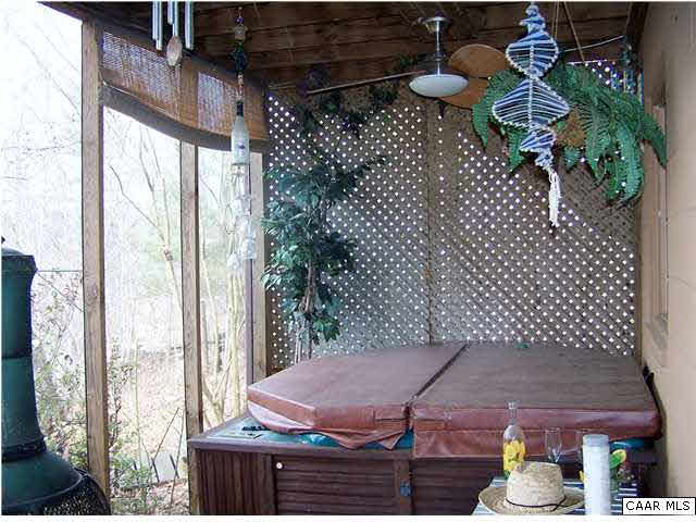 540 Jonquil Road Ruckersville, VA 22968 - Photo 21 of 32 a balcony with table and chairs