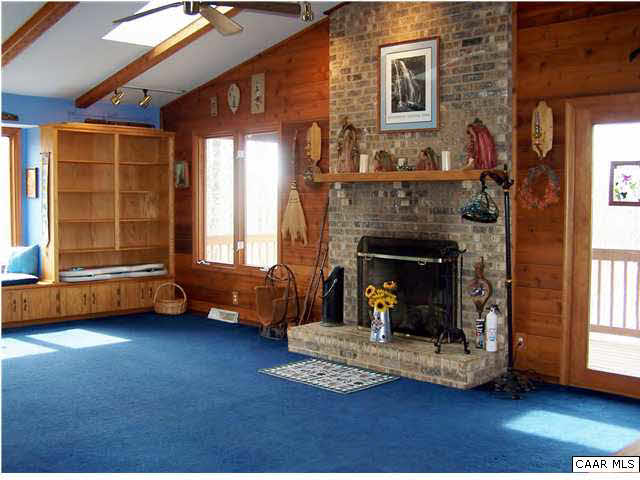 540 Jonquil Road Ruckersville, VA 22968 - Photo 5 of 32 a living room with furniture and a fireplace