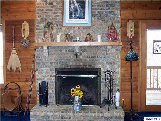 540 Jonquil Road Ruckersville, VA 22968 - Photo 8 of 32 a living room with furniture and a fireplace