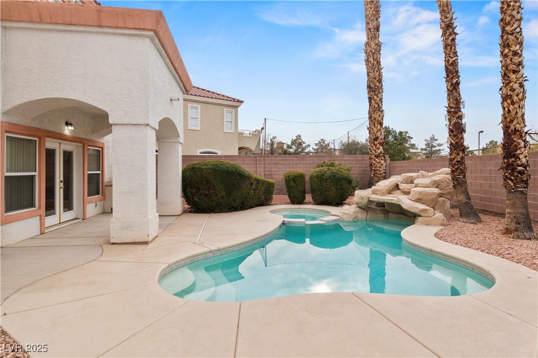 2576 Mizzoni Circle Henderson, NV 89052 - Photo 2 of 44 This backyard features pool, spa, waterfall, covered patio, built-in BBQ and no rear neighbors.