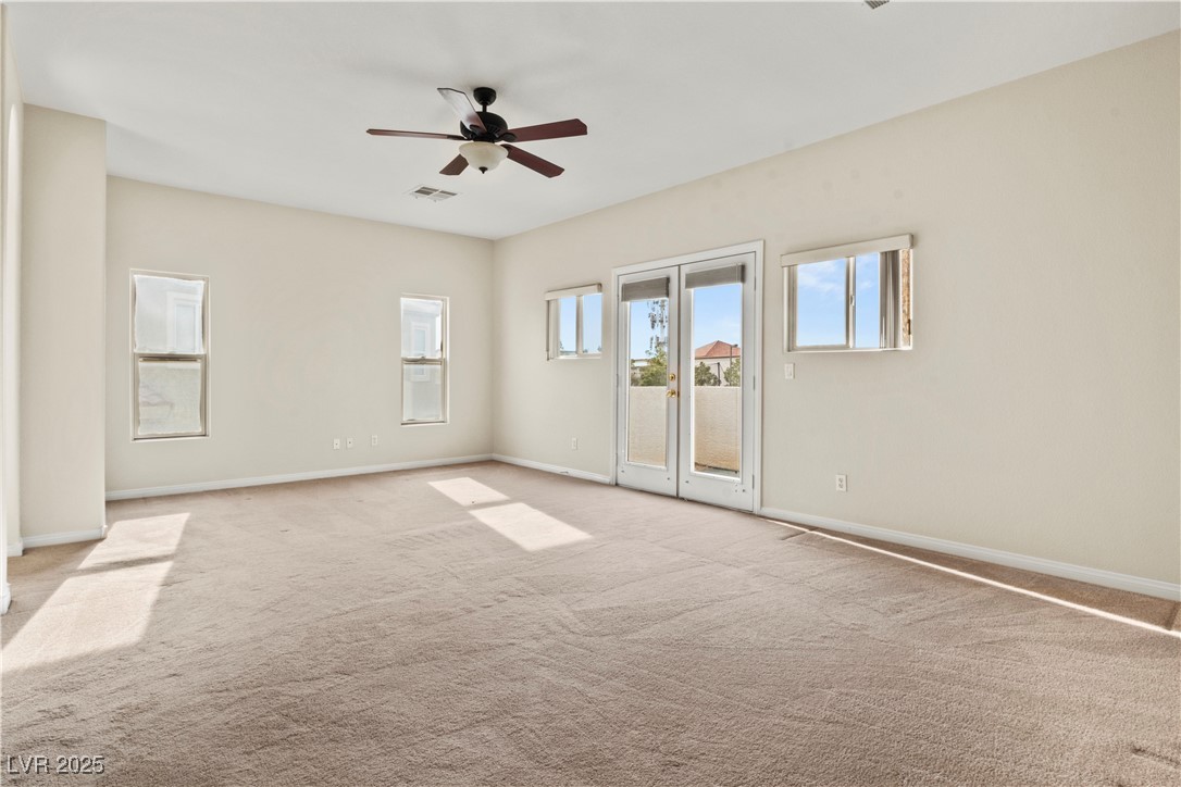 2576 Mizzoni Circle Henderson, NV 89052 - Photo 24 of 44 Spacious primary bedroom has a walk-in closet and balcony