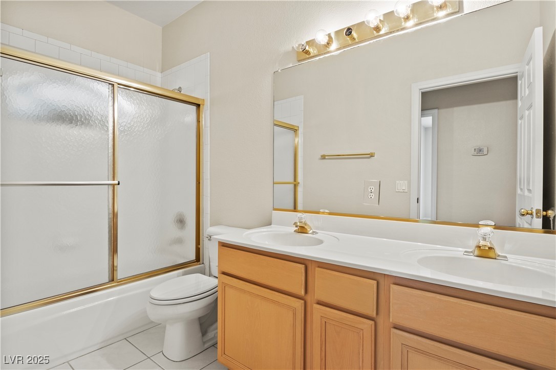 2576 Mizzoni Circle Henderson, NV 89052 - Photo 34 of 44 Hall bathroom has double sinks and a tub/shower combination.