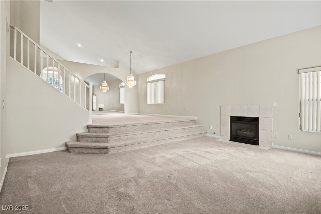 2576 Mizzoni Circle Henderson, NV 89052 - Photo 4 of 44 Living room has vaulted ceilings and fireplace.