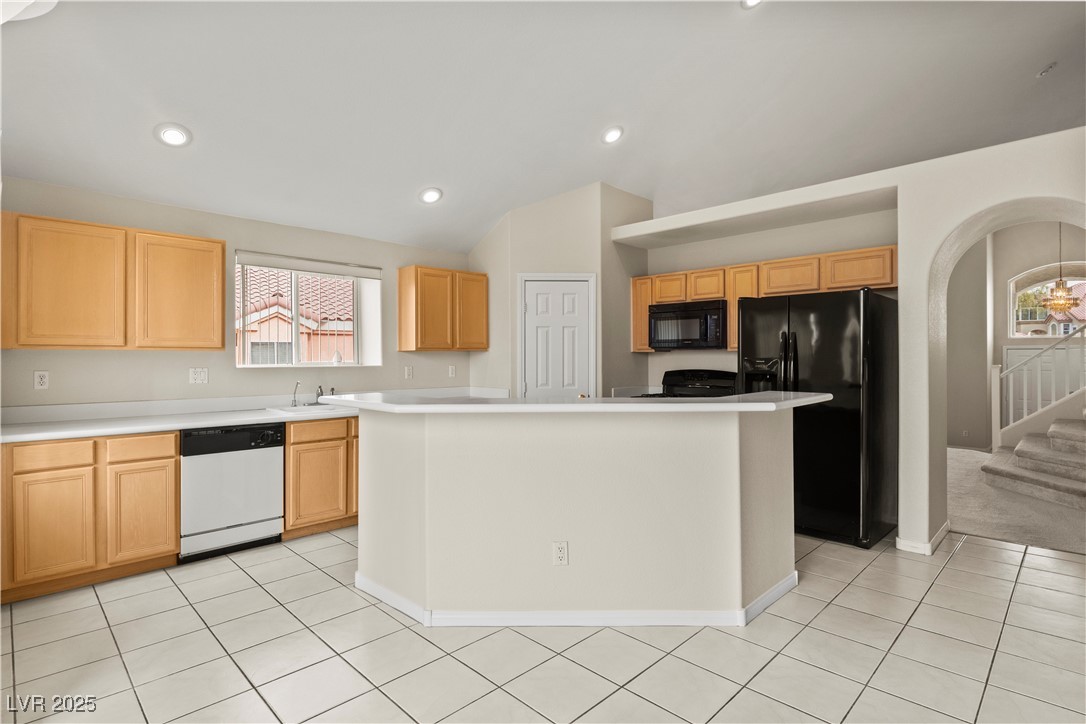 2576 Mizzoni Circle Henderson, NV 89052 - Photo 8 of 44 Kitchen has tile flooring, solid surface counters, breakfast bar and breakfast nook and walk-in pantry.