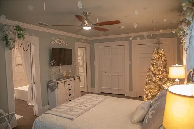 a spacious bathroom with a double vanity sink mirror and shower