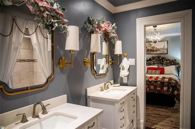 a bathroom with a sink mirror and vanity